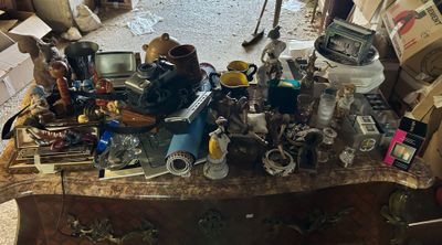 a table with a lot of assorted items on top of it
