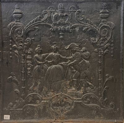 Importante plaque de cheminée en fonte à décor de personnage…