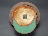 a brown hat with a green brimle on it