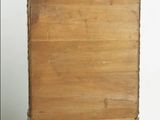 an old wooden dresser with a drawer on top of it