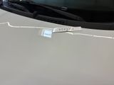 a sticker on the hood of a car that has a sticker on it