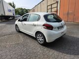 a picture of a white car parked in a parking lot