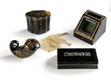 a picture of a collection of items that include a pipe, a box, and a picture frame