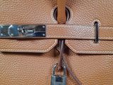a close up of a purse with a lock on it