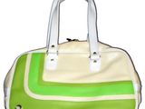 a green and white handbag on a white background