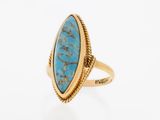 a gold ring with a turquoise stone in the center