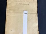 an old piece of paper with writing on it sitting on a table