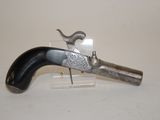 an old gun that is on display on a table