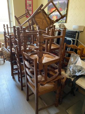 a lot of chairs that are stacked on top of each other