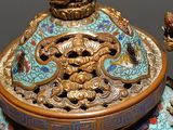 a blue and gold vase with a dragon on it