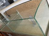 a fish tank with a glass top on a table