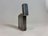 a silver lighter that is sitting on a table