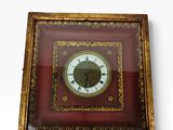 la photo d'une photo représentant une horloge dans un cadre