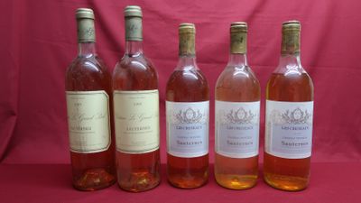 six bottles of wine are lined up in a row on a red background