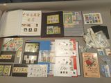 a lot of stamps on a table with a book