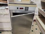 an image of a kitchen with a stove and a dishwasher