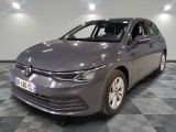 the grey volkswagen golf is parked on a checkered tile floor