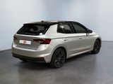 the rear end of a silver car in a white room