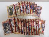 a lot of anime cards that are on the table