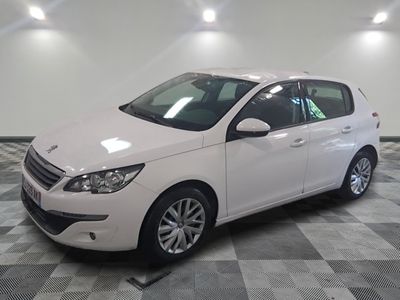 a picture of a white car parked in a showroom