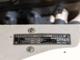 a close up of a white machine with a number on it