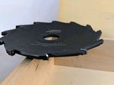 a circular saw blade on a piece of wood