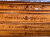 a marble top dresser with a marble top on it