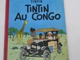 an old children ' s book with a picture of a giraffe and a car