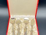 silverware in a red case on a black background