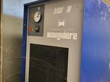a blue machine that is sitting in a room
