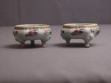 two small bowls sitting on top of a table