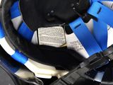 a close up of a helmet with a blue and white stripe