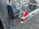 a boat trailer with a trailer attached to it