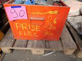 a red box with a price sign on it sitting on a pallet