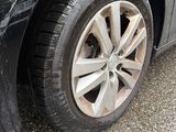 a black car that has a flat tire on it