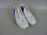 pair of white and blue tennis shoes sitting on top of a white surface