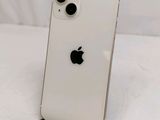 a close up of the back of a white iphone with an apple logo on it