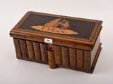 an old wooden box with a map on it sitting on top of a table