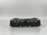 a toy train on a white surface with a white background