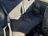 the interior of a car with the seat up and the front seats down