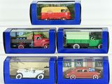 three boxes of toy cars are stacked on top of each other