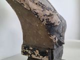 sculpture of a bust of a woman on a glass table