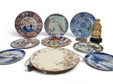 a lot of plates that are sitting on a table