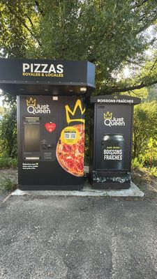 two vending machines that have pizzas on them