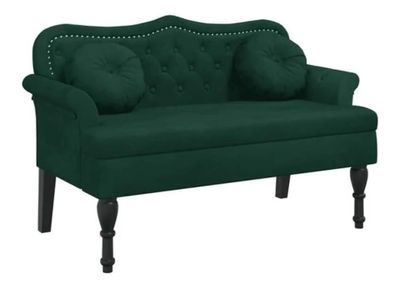 the green couch is sitting on a white background