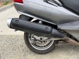 a motorcycle that is parked on the side of the road