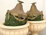 two vases that are sitting on a table