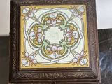 a small wooden box with a decorative design on it