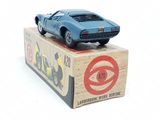 a blue toy car sitting on top of a box