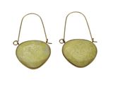 a pair of earrings with a yellow stone in the shape of a heart